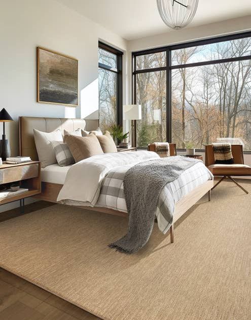 Plush carpet area rug with linear/ribbed striate texture in modern bedroom