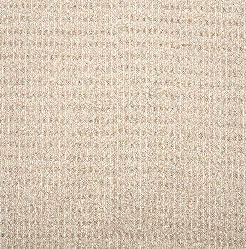 Beige solid distressed berber carpet