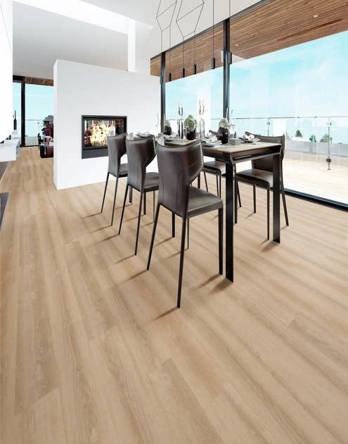 Modern dining area set over light beige, clean floors, with architectural leather chairs, feature fireplace, and bank of large windows