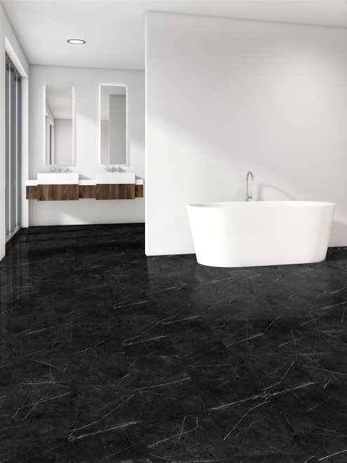 Crisp, clean bathroom with white walls, wood accents, and black Marquina Nero Black marble-look LVT