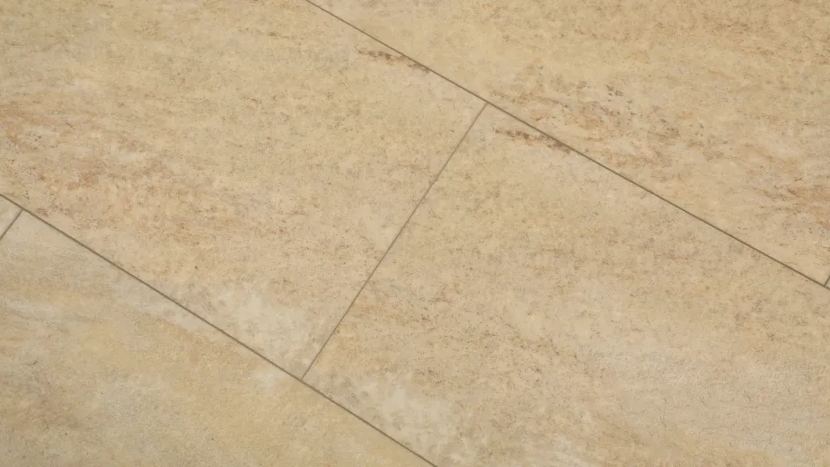 Sample of Rejuvenation 535, a stone-look luxury vinyl tile with cream and sand tones