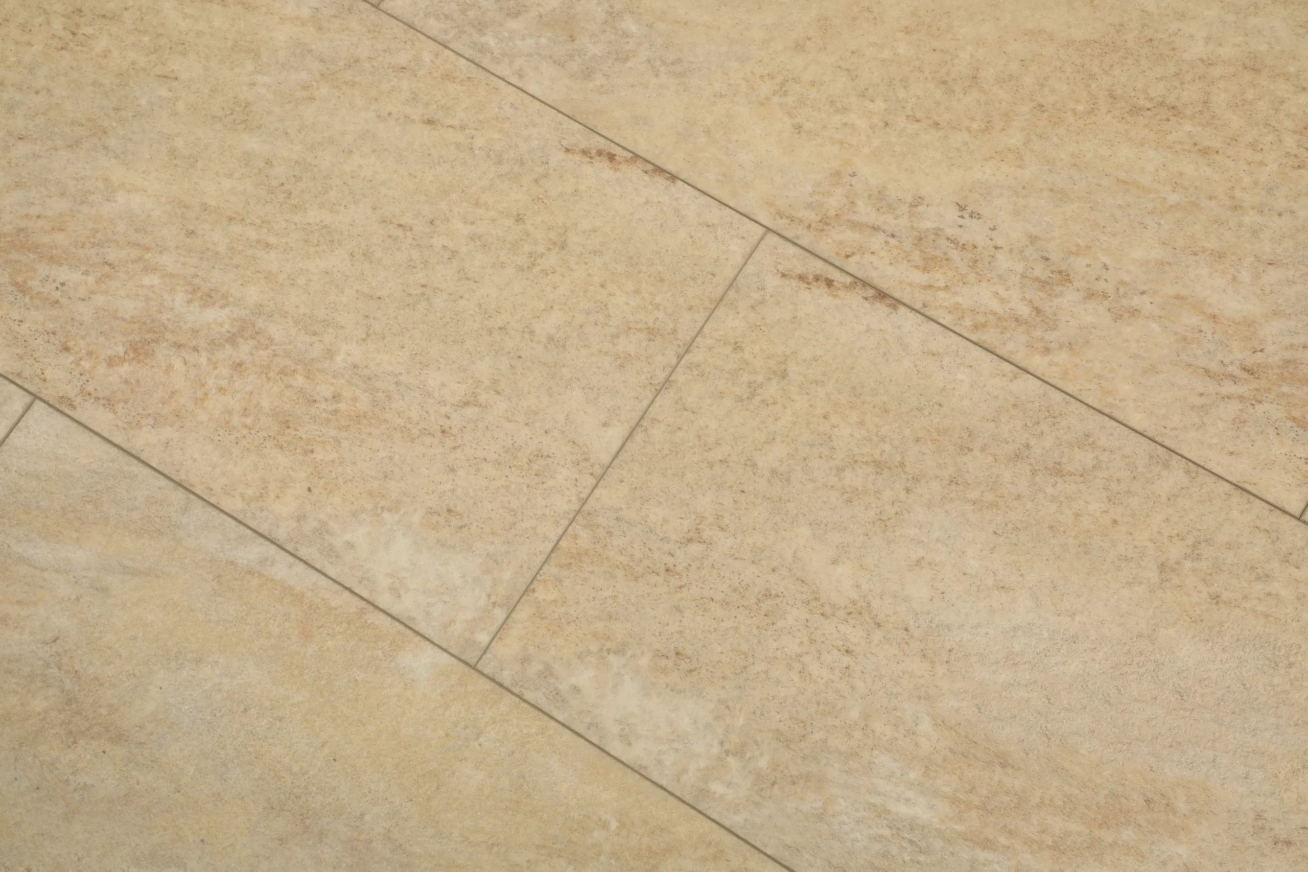 Sample of Rejuvenation 535, a stone-look luxury vinyl tile with cream and sand tones
