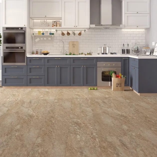 Blue and white kitchen with bag of groceries on beige, gray, and cream speckled stone luxury vinyl tile