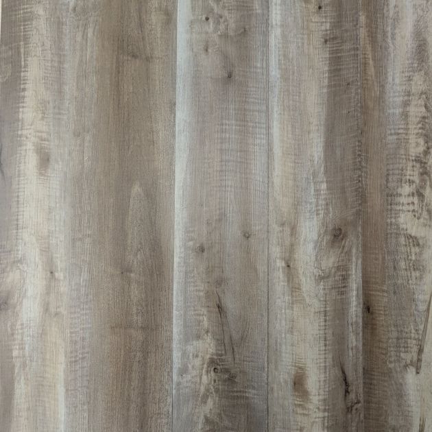 Tavern Oak luxury vinyl plank sample showing grays and taupes for a rustic, slightly weathered wood look