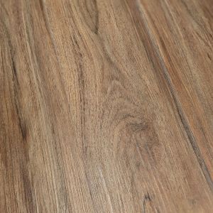 Sample of Teak Marado, a warm brown luxury vinyl plank with wood knots and grains