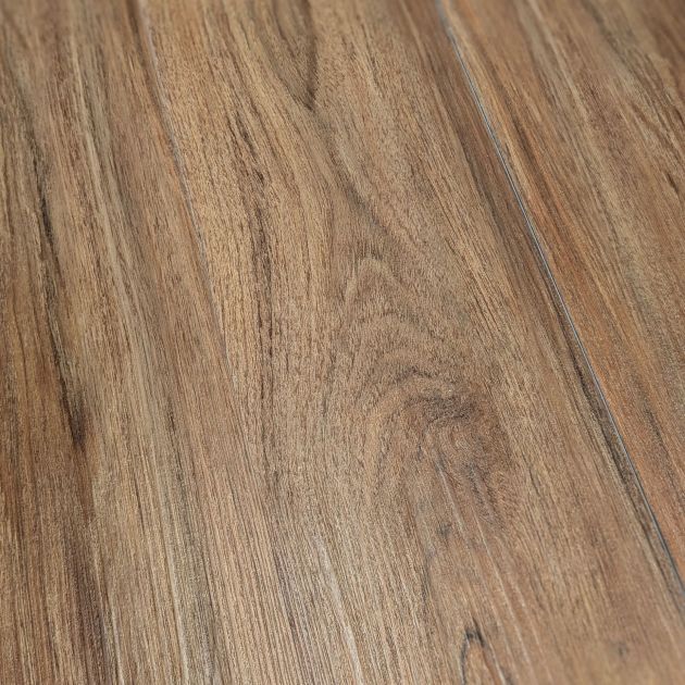 Sample of Teak Marado, a warm brown luxury vinyl plank with wood knots and grains