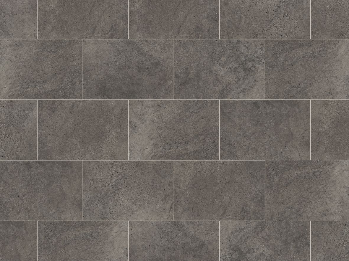 Cumbrian Stone LVT sample, a dark gray tile with a painted bevel edge
