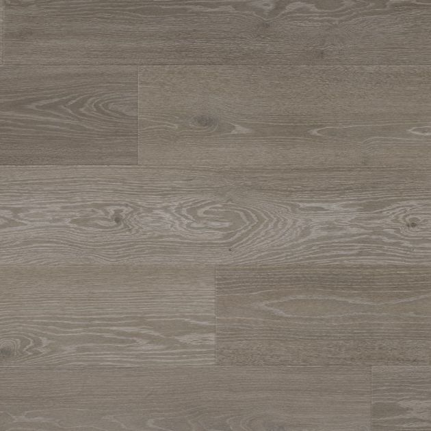 Sample of Grey Artisan Oak luxury vinyl plank, showing medium gray wood plank with blue-gray undertones, knots, and grain detail