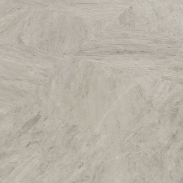 Sample of Ionic Marble LVT, a gray luxury vinyl tile with white and medium gray veining for a clean, neutral design