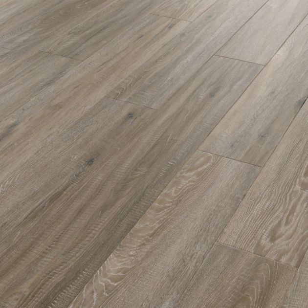 Sample of Tweed Oak, a luxury vinyl plank blending mid brown, blue, and gray tones with subtle knots and woodgrain texture