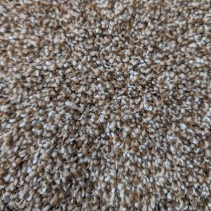 Close up of Lakepoint 908 carpet sample showing twisted fibers in various brown tones