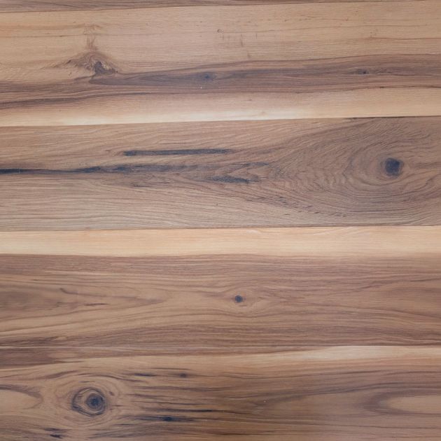 Smoked Amber LVP planks, showing high tonal variation and knots