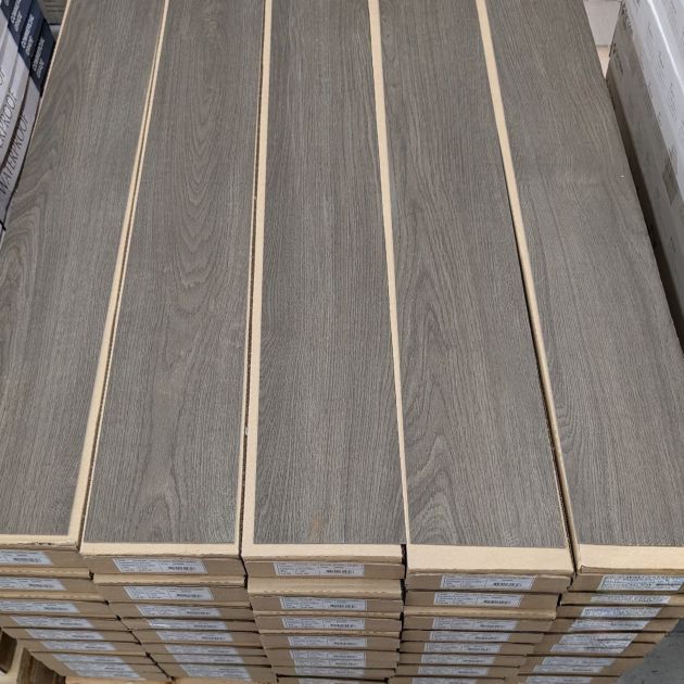 Glue down Arbor luxury vinyl plank samples atop sealed boxes on pallet