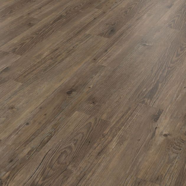 Angled view of Ignea luxury vinyl plank sample showing medium beige and taupe tones, knots and grains, and rustic feel