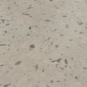 Luca LVT sample, a gray terrazzo style tile flecked with darker gray and brown spots