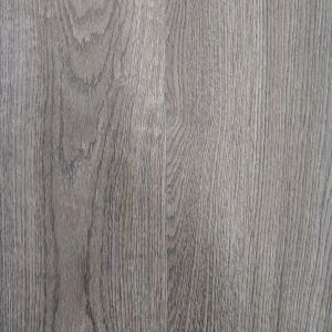 Arbor glue down luxury vinyl plank sample showing woodgrain design, brown tones, and subtle warm undertones