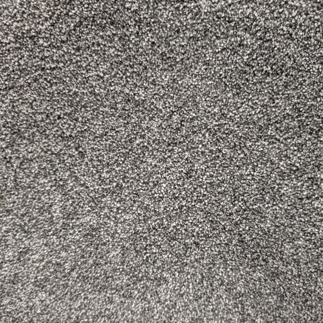 Ritzy 60 Lava carpet sample showing gray, black, and white tones and plush texture