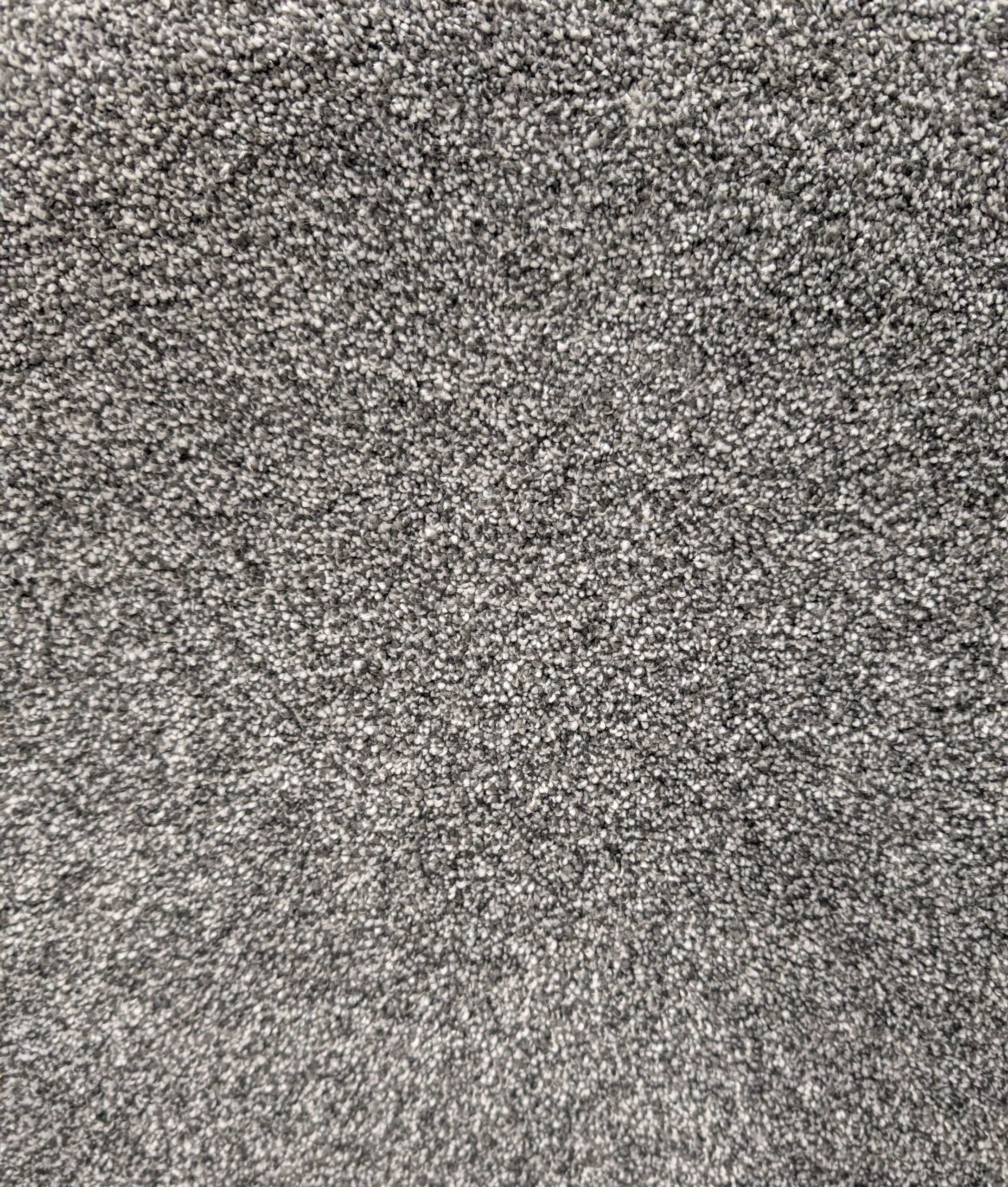 Ritzy 60 Lava carpet sample showing gray, black, and white tones and plush texture