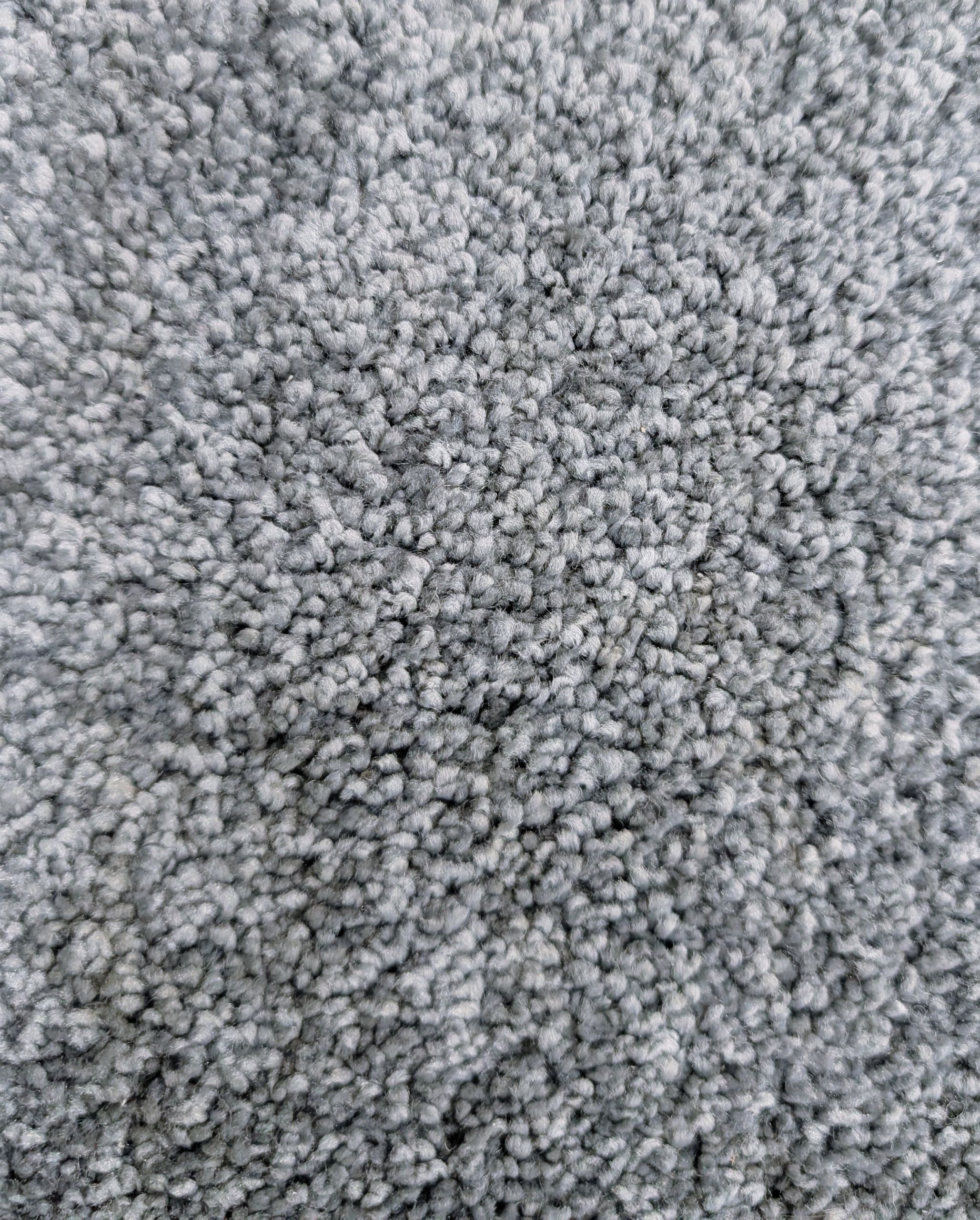 Close up of Throne Bluestone carpet highlighting plush texture, grayish blue color, and slight sheen