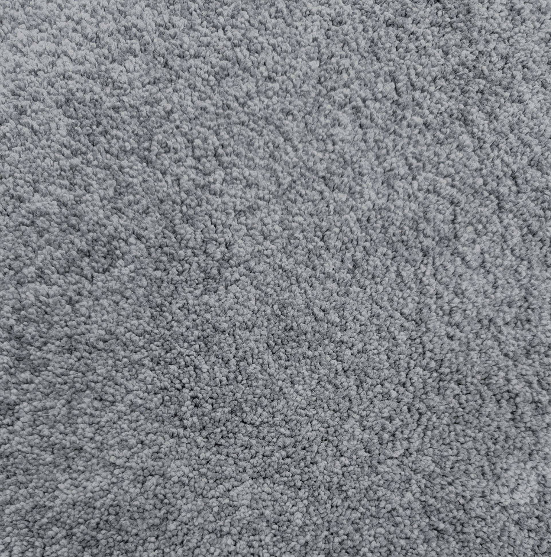 Sample of Throne Bluestone, a plush grayish blue carpet with slight lustrous shine