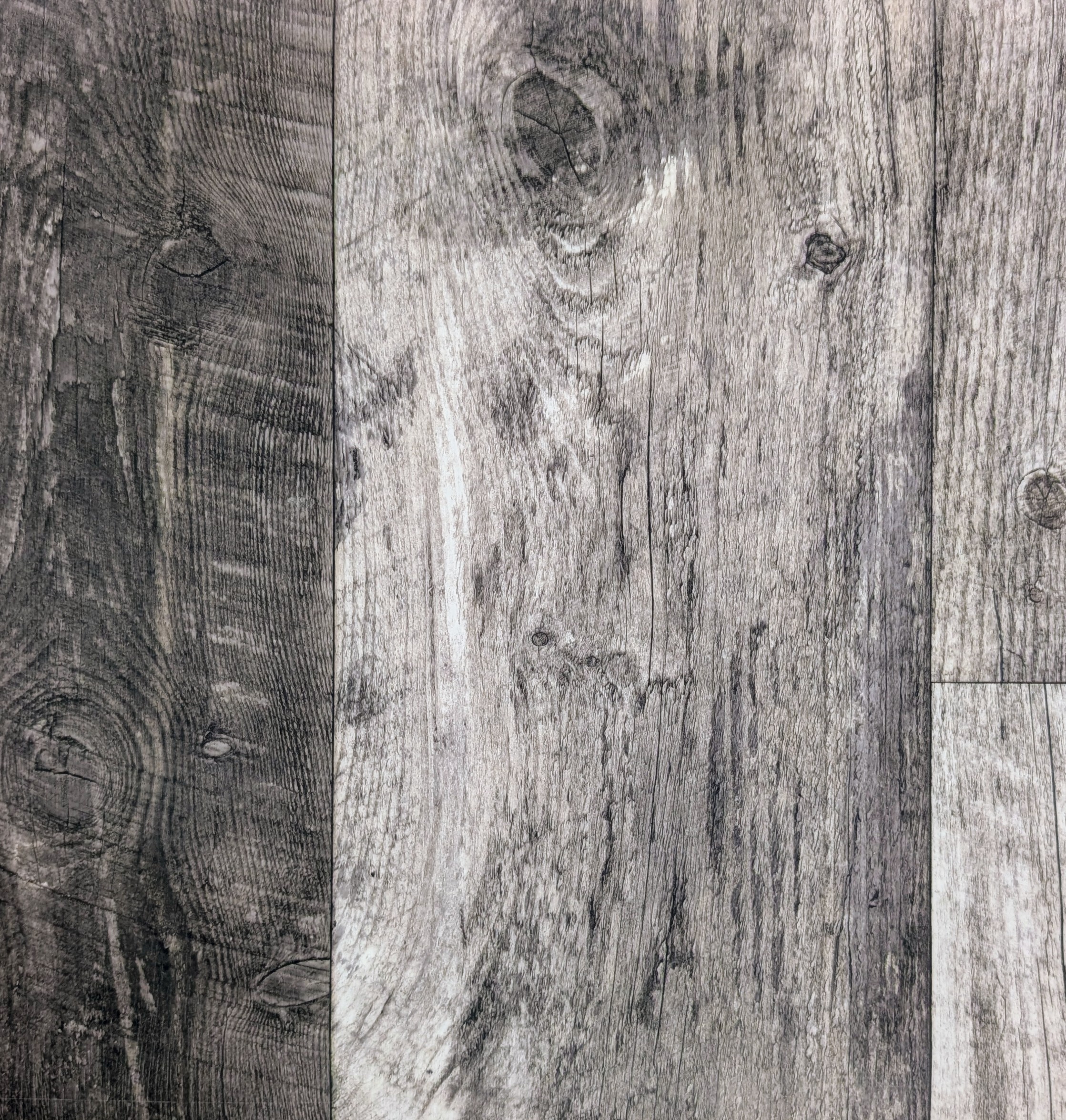 Mountain Side luxury vinyl sheet sample, a high variance gray weathered, reclaimed wood design