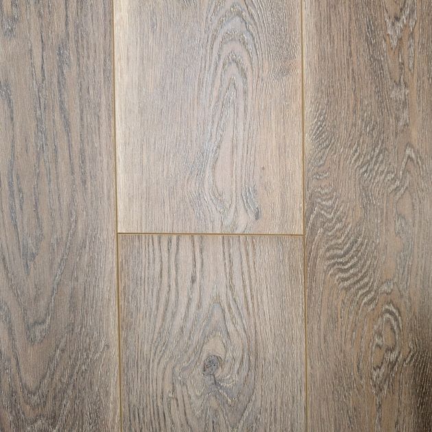 Sample of Urban Oak laminate floor showing various brown tones and woodgrain design